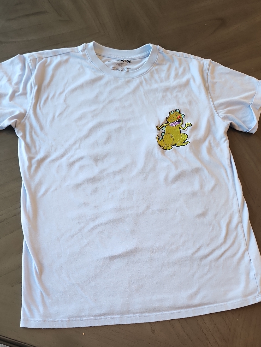 Nickelodeon Baby Blue Tee with Rugrats Reptar Chest Patch and Characters On Back